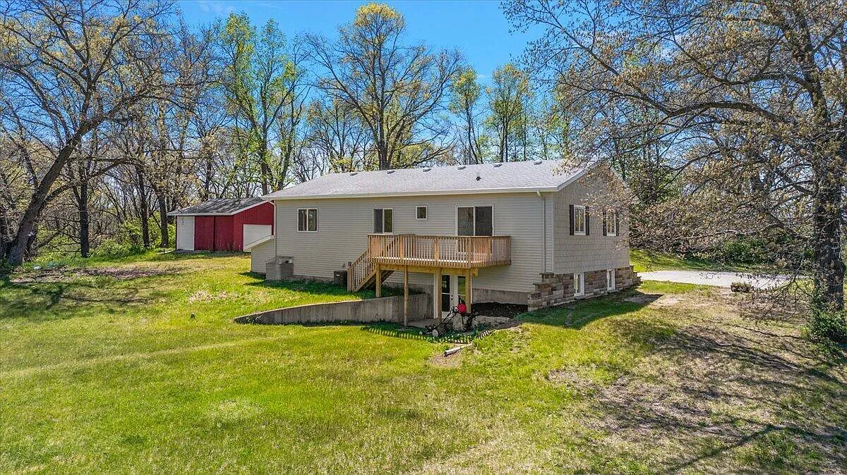 Finished residence with deck and outbuilding