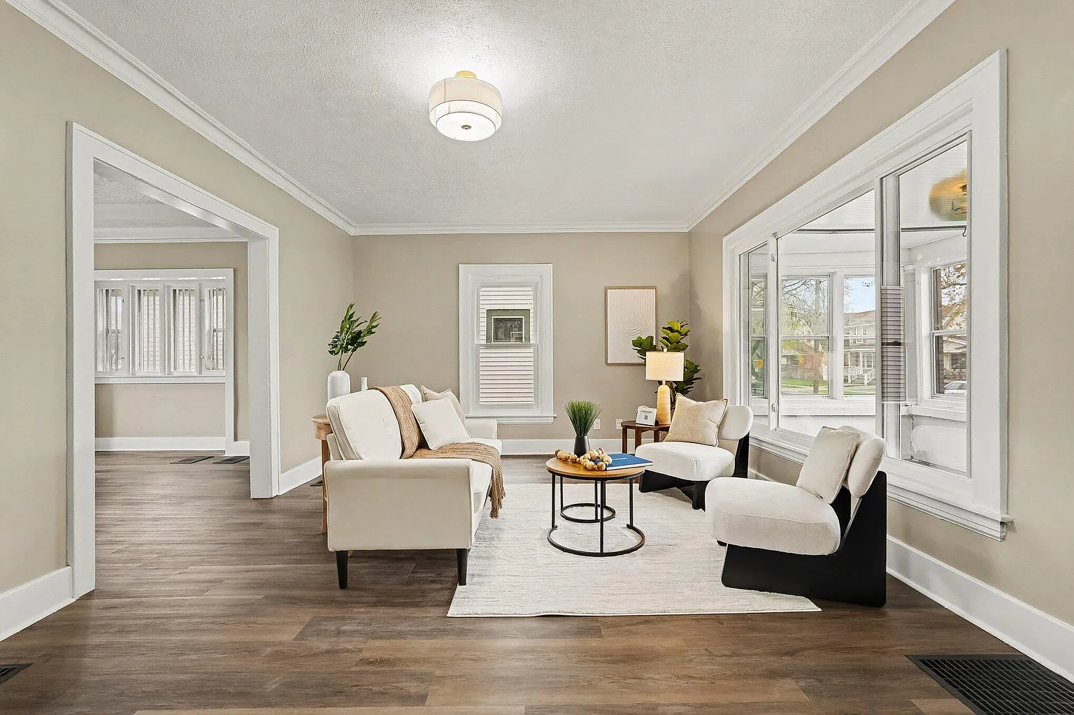 Renovated living room with new floors and trim